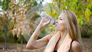 Woman drinking pure bottled water