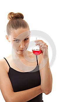 Woman drinking a red liquid