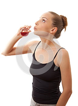 Woman drinking a red liquid