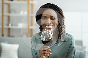 Woman Drinking Red Wine In Video Conference