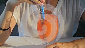 Woman drinking Refreshing orange cocktail