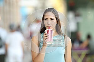 Woman drinking a takeaway refreshment