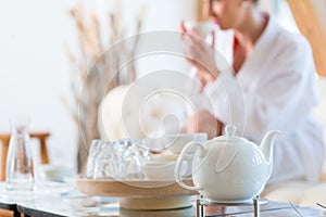 Woman drinking tea in wellness spa