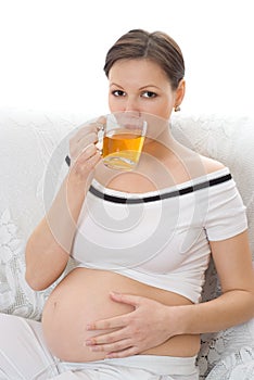 Woman drinking tea on a white background