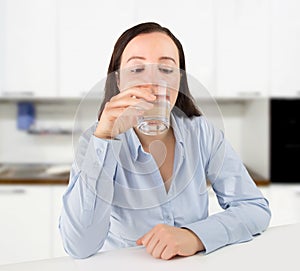 Thirsty woman drinking water photo