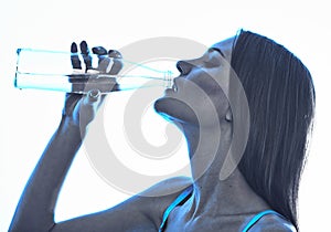 Woman drinking from water bottle