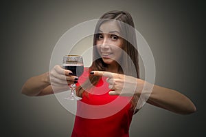 Woman drinking wine from wineglass.