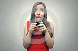 Woman drinking wine from wineglass. photo