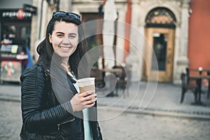 Woman drinks coffee outside