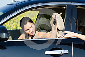 Woman driver being handed her car keys