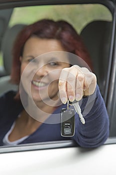 Woman driver holding car keys