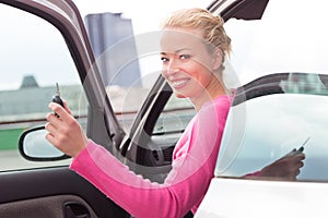 Woman driver showing car keys.