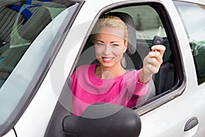 Woman driver showing car keys.