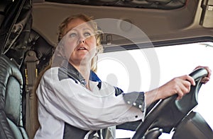 Woman Driving a Big Truck Checking Her Mirror on the Off Side