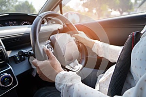 Woman driving car in enjoy holiday retirement life