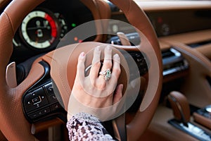 Woman driving car, Hand hold steering wheel, close-up