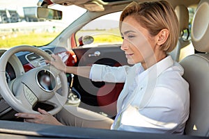 Woman driving car having business auto travel in her automobile