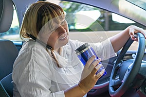 Woman driving a car with his hands busy