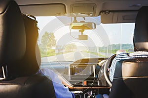 woman driving car and passenger on front seat