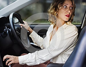 Woman driving a car in reverse