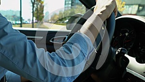 Woman driving car in reverse gear attentive driver looking for free parking spot