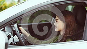 Woman driving car and smile