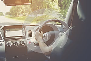 Woman driving car, steering wheel of a car