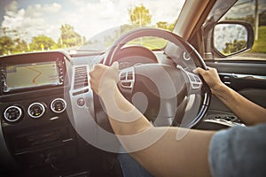 Woman driving car, steering wheel of a car