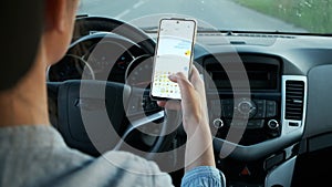 Woman driving car texting message on mobile phone in motion, don't text and drive