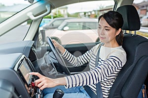 Woman driving car and using GPS system