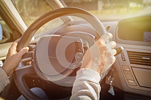 Woman driving a car, view from behind