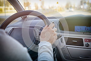 Woman driving a car, view from behind