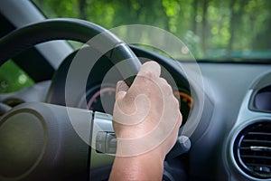 Woman driving a car, view from behind