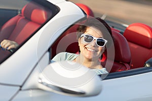 Woman Driving a Convertible