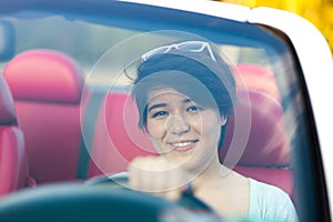 Woman Driving a Convertible