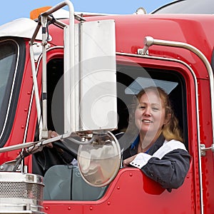 Woman driving an eighteen wheeler.