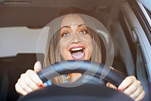 Woman driving. emotion. Screaming, scared.