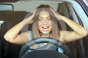 Woman driving. emotion. Screaming, scared.