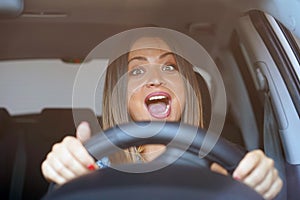 Woman driving. emotion. Screaming, scared