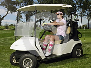 Woman Driving Golf Cart