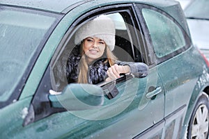 Woman driving showing car keys out the window