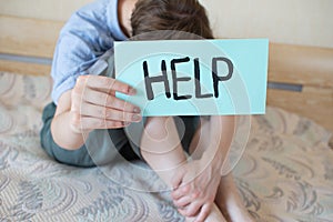 Woman drug addict and alcoholism alone, depression, stress, sitting on the floor in his bedroom. Headache, dizziness