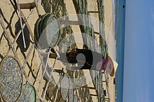 Woman drying fish