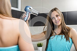 Woman drying hair