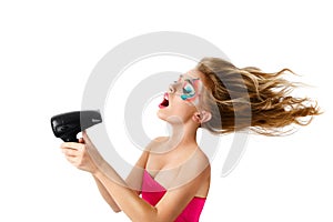 Woman drying hair with fan