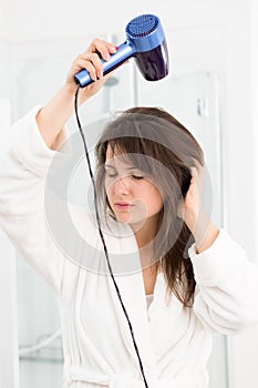 Woman drying hair hair