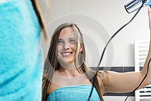 Woman drying hair