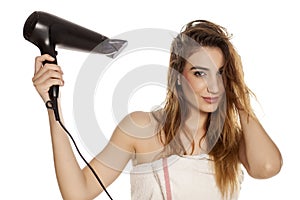 Woman drying her hair