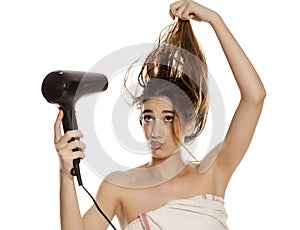 Woman drying her hair