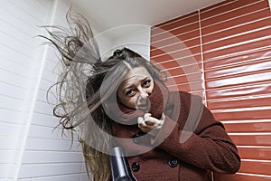 Woman drying her hair